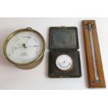 Leather cased gilt pocket barometer and unusual Ne