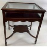 A 20th century mahogany glass display cabinet on s