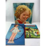 A Shirley Temple 'Dolls and Dresses' book, a Shirl