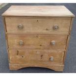 A Victorian pine chest of three long drawers