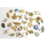 A good collection of vintage brooches, many of flo