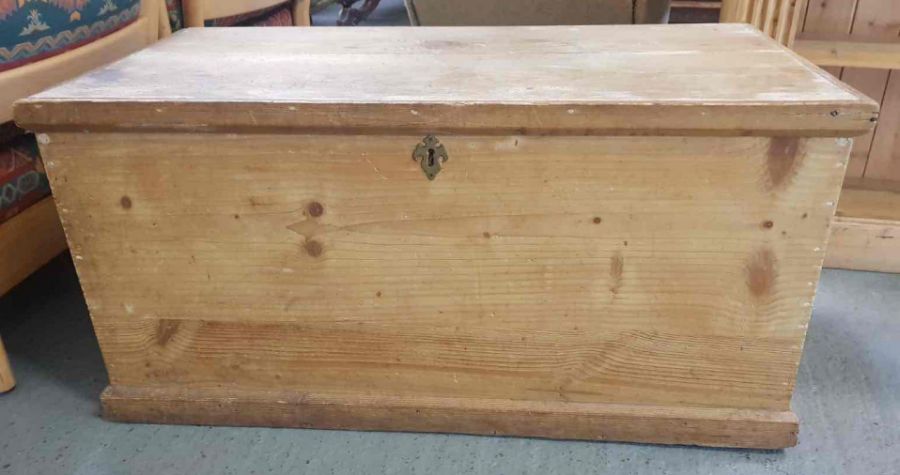 A Victorian pine blanket box, with brass swing han