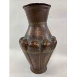 A 20th century hammered copper vase, of waisted fo