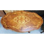 A 20th century marquetry coffee table, 52cm high,
