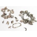 A silver charm bracelet with various charms attach