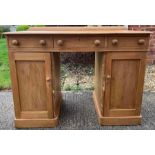 A Victorian pine twin pedestal kneehole desk, 107c