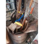 Wooden barrel of gardening tools