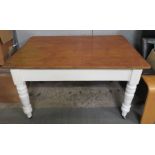 A 20th century pine kitchen table, with a white pa