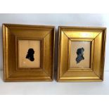 A pair of Victorian silhouette portraits, in gild