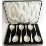 A set of six cased Art Deco silver dessert spoons