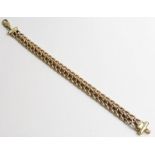 A 9ct yellow gold double filed curb link bracelet