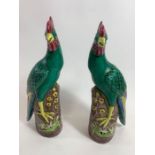A pair of Chinese ceramic models of phoenixes, decor