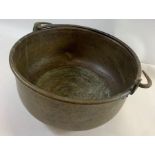 A 20th century hammered copper cooking pot/pan wit