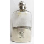 A ribbed cut glass hip flask with applied monogram