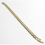 A gentleman's 9ct yellow gold filed curb link brac