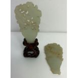 A pair of Chinese white jade carvings, each of flo