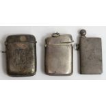 A plain silver kidney shaped vesta, with another,