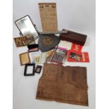 A box of assorted items including a carved wood bo