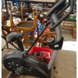 Reebok RB1 exercise bike along with lifting weight