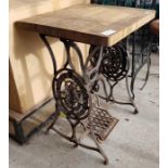 SInger iron treadle base table with oak top