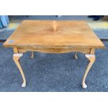 Extending dining table with cabriole legs