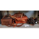 Vintage binoculars, vintage cameras in leather cas