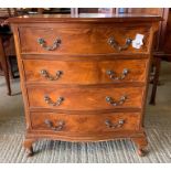 Serpentine front walnut chest of drawers