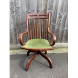 An Edwardian ash stick back swivel office chair wi