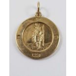 A 9ct gold round St Christopher pendant, with feat