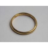 A slim wedding band, marked '18ct', 2.06 grams gro