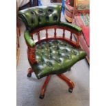 A Victorian style green leather and stained wood s