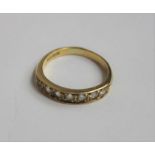 An 18ct gold diamond half eternity ring, with seve
