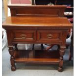 A Victorian oak buffet with raised back, two short
