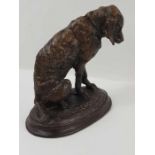 A bronze sculpture of a hound, signed to the base