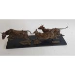 A bronze sculpture of three cows 'Turnout', on a b