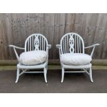 A pair of white painted Ercol chairs with open arm