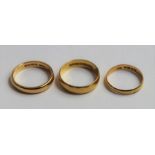 Three 22ct gold wedding bands, 5mm 3.7mm and 3.4mm