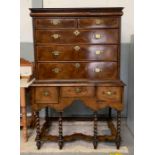 An 18th century walnut veneered chest on stand the
