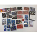 A collection of commemorative coins and proof coin