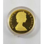 An Elizabeth II Canadian 1986 100 dollar coin