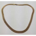 A 9ct gold flat fancy link necklace, 6mm wide, 41c