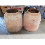 A pair of terracotta rhubarb forcers, 37cms high