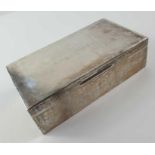 A silver cigarette box, of rectangular form, wood