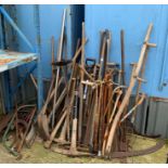 Large quantity of garden tools including pick axes