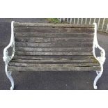 White painted cast iron bench with wooden slats