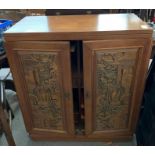 Chinese carved hardwood panelled drinks cabinet wi