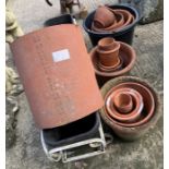 Quantity of terracotta pots along with a wrought i