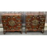 A pair of Chinese elm brass mounted cabinet, the i