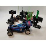 Three radio controlled cars and controllers, proba