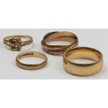 A wide 9ct gold wedding band, 7mm, court shape; a